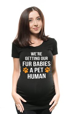 a pregnant woman wearing a t - shirt that says we're getting our fur babies a pet human