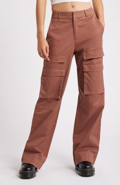 These trend-right pants are crafted from a durable cotton blend with cargo pockets for a utilitarian vibe. 32" inseam; 21" leg opening; 12" front rise; 14 1/2" back rise (size 29) 49% cotton, 48% lyocell, 3% spandex Machine wash, line dry Imported Straight Leg Cotton Cargo Pants With Pockets, Cotton Cargo Jeans In Straight Fit, Cotton Tapered Leg Cargo Pants With Multiple Pockets, Cotton Cargo Pants With Multiple Pockets And Tapered Leg, Cotton Cargo Pants With Tapered Leg And Cargo Pockets, Mid-rise Cotton Parachute Pants With Pockets, Full-length Cotton Cargo Pants With Hip Pockets, Full Length Cotton Cargo Pants With Hip Pockets, Cotton Straight Cargo Pants