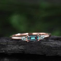 a close up of a ring on top of a piece of wood