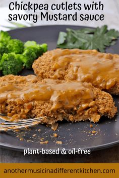 two pieces of chicken cutlets with savory mustard sauce on a plate next to broccoli