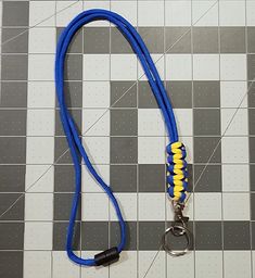 Blue and yellow lanyard with removable keychain, and safety breakaway. Hand made Lanyard perfect for holding I.D. Badges, keys and much more. These are extremely light weight and comfortable to wear. The buckle allows the end to be detached and re-attached for use with keys, cardswipes, or other items without having to remove the neck lanyard. These lanyards are a unique and functional gift that can be given in traditional settings (birthdays, anniversaries, holidays, special occasions, etc...). They can also work as party favors, teacher gifts, good luck, team or school spirit gifts, Boy/Girl Scout Troop event gifts, and much, much more - really limited only by your imagination. Show your support for a cause that is important to you with a customized paracord lanyard. From celebration to Blue Lanyard With Key Leash For Personal Use, Adjustable Lanyard With Lobster Clasp For Personal Use, Adjustable Lanyards With Swivel Clip For Everyday Use, Adjustable Lanyard With Swivel Clip For Everyday Use, Adjustable Lanyards With Key Clip For Personal Use, Adjustable Lanyards With Lobster Clasp For Everyday Use, Knife Lanyard, Paracord Lanyard, Id Lanyard