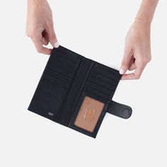 Designed to be your daily companion, this wallet is made to function as your everyday wallet with compartments for your cash, cards and ID. Essential Bifold Wallet In Soft Saffiano Leather  Black LARGE WALLET in Black | Hobo® Large Wallet, Bifold Wallet, Wallet, Leather, Black