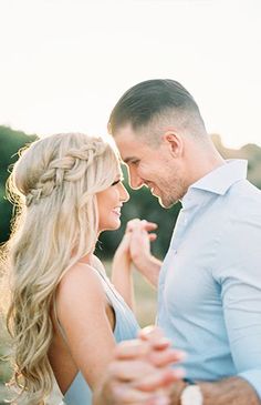 a man and woman standing next to each other