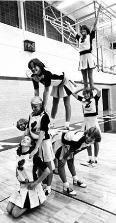 the girls are doing tricks on the basketball court