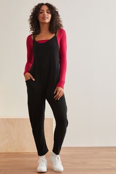 Instantly elevate your athleisure looks with this jumpsuit, perfect for all seasons. Guaranteed to be a new go-to, this one-piece features a soft ribbed fabrication, a slouchy style with front pockets, a v-neckline, and cozy relaxed fit. Pair with your favorite sports bra or strappy tank for the coolest fit for all your travel days. White Dress Boots, Athleisure Looks, Slouchy Style, Cool Fits, Fall Collection, Altar'd State, New Tops, Dress Romper, Dress First