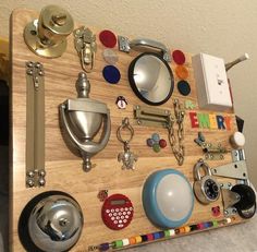 a wooden board with various items on it and a key chain hanging off the side