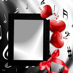 two red hearts sitting in front of a black frame with music notes around it and a red ribbon