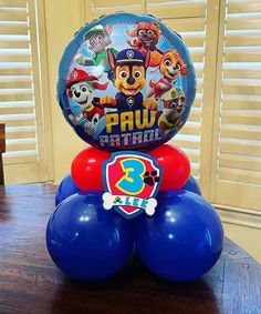 some balloons are stacked on top of each other in the shape of paw patrol characters