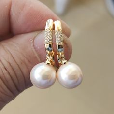 Welcome to my shop my dear friend. I hope you will like my jewelry, and most of my jewelry are made by myself. Please see the detail for this item: Pearl Jewelry: earrings material: shell pearl, Gold plated luster: good Size: 12mm in the pictures Pearl Color: as the pictures other color size, could contact me please. About shipping: I will send out your order in 3-5 business days from China. Generally takes 10-20 days to reach. Sometimes maybe a little earlier or later Please note that the Unite Pearl White Round Earrings For Everyday, Gift Pearl Earrings With Round Beads, Pearl Earrings With Round Beads As Gift, Pearl Earrings With Round Beads For Gift, Hypoallergenic Beaded Earrings For Anniversary, Pearl Jewelry Earrings, Pearl Powder, Earrings Everyday, My Dear Friend