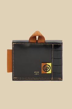 Envoy easily holds upwards of seven cards in a luxe croc-embossed calf leather. A nylon webbing folded loop accent is a nod to the season's journey of exploration. DESIGN- A mini wallet in croc-embossed leather for credit cards and bills.- Flap closure with gold snap- Width: 4.25", Height: 3 1/2", Depth: 1.2"FABRIC & CARE- 100% calf leather- Ethically made in the U.S.A.SUSTAINABILITY- This product was created using a custom pattern to create the amount of material waste possible.- Designed and m Black Leather Wallet With Crocodile Pattern, Black Leather Wallets With Crocodile Pattern, Daily Use Leather Wallet With Crocodile Pattern, Leather Wallet With Crocodile Pattern For Daily Use, Business Leather Card Holder With Crocodile Pattern, Leather Bifold Card Holder With Crocodile Pattern, Functional Leather Rectangular Wallet, Leather Crocodile Pattern Card Holder For Everyday Use, Snap Wallet