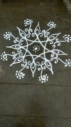 a white painted snowflake on the ground