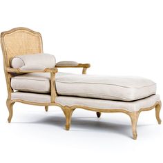 an old fashioned chaise lounge chair with wicker backrests and foot rest