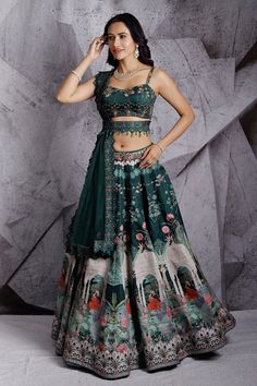 Green digitally printed and attached can can lehenga has an embroidered waistband. Paired with padded blouse is highlighted with hand embroidery with gold sequins, beads. Comes with a bordered dupatta and embroidered belt.
Component: 4
Pattern: Embroidered,Printed
Type Of Work: Floral,Regal 
Neckline: Sweetheart
Sleeve Type: Sleeveless
Fabric: Lehenga and Blouse: Raw Silk, Dupatta: Net
Color: Green
Other Details: 
Weight approx (in kg): 3.5
Cutwork dupatta
Floral and regal motifs
Occasion: Bride Shimmer Lehenga, Grey Lehenga, Raw Silk Lehenga, Set Saree, Green Lehenga, Embroidered Belt, Lehenga Blouse, Wedding Lehenga, Silk Lehenga