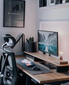 a desk with a monitor, keyboard and mouse on it