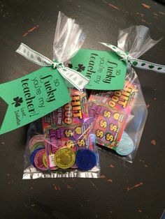 some candy is wrapped in plastic and tied to a table with green tags on it