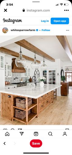 the instagram page shows an image of a kitchen with white countertops and wooden beams