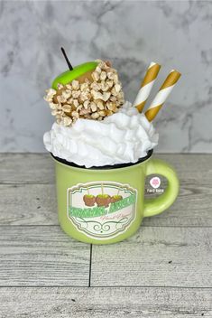 a cup filled with whipped cream and toppings