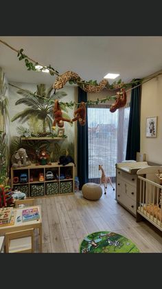 a baby's room is decorated with jungle animals