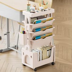 a white cart with books, magazines and pens on it in front of a desk