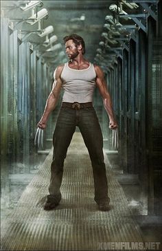 a man standing next to another man in a hallway with the words hugh jackman as wolverine