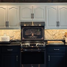 a stove top oven sitting inside of a kitchen