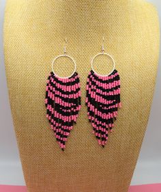 This Zebra print beaded fringe earrings are made of seed beads, silver plated ear hooks, nylon thread, silicon plugs. All the color fit perfectly the Christmas celebration and give a mesmerizing look that fits every outfit! Fringe earrings size: The full length of earrings with hook is 4.75 inches approximately, the length from top of the ring to bottom of earrings is 4 inches. Please contact me if you want these earrings in another size. - Thank you for visiting MannatDesignCo! I am honored tha Pink Beaded Fringe Earrings With Round Beads, Pink Round Beaded Earrings With Dangling Beads, Pink Dangle Beaded Earrings With Black Beads, Pink Beaded Earrings With Black Beads For Gift, Fringe Earring, Beaded Fringe Earrings, Christmas Celebration, Black Fringe, Beaded Fringe