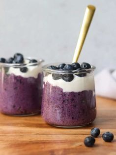 blueberry chia pudding in small glass jars on a wooden table with text overlay