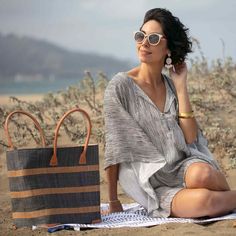 Looking for a unique and gorgeous beach tote? This raffia bag is made from high-quality raffia palm with a natural and grey alternating stripe. These bags have a useful cotton pull closure, inside pocket, and beautiful zebu leather handles, and are big enough to handle even the longest beach days! All our raffia totes are made by a fair-trade woman-owned company in Madagascar. 17.5" x 13.5" x 8" 7" handle drop. Striped Woven Rectangular Beach Bag, Summer Striped Woven Straw Bag, Striped Beach Bag For Travel, Casual Striped Straw Bag For Beach, Beach Bag With Bamboo Handle For Vacation, Casual Striped Straw Bag For Vacation, Rectangular Striped Straw Bag For Summer, Striped Summer Beach Bag, Summer Striped Woven Beach Bag