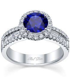 Blue sapphire halo ring with baguette diamond side stones on the band. Luxury Round Cut Sapphire Ring With Halo, Dazzling Round Sapphire Ring With Halo Setting, Sapphire Diamond Wedding Ring With Halo Setting, Sapphire Diamond Ring With Halo, Round Cut, Blue Sapphire Ring With Halo Design, Round Cut, Double Halo Engagement Ring Round, Mom Rings, Ring With Baguettes, Round Halo Ring