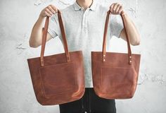 Leather tote bag. One of the best selling bags of this season. Can serve as a gift to your family members or just a friend. We can put your initials on this product or perform any other modification, especially for you!BAG MAKES in 4 SIZES:Small: 13" wide x 11.5” tall [33 cm wide x 29 cm tall]Medium: 15" wide x 12" tall [38 cm wide x 30 cm tall]Large: 18" wide x 12" tall [45 cm wide x 30 cm tall]Extra Large: 21" wide x 13” tall [53 cm wide x 33 cm tall]PERSONALIZATION:Pick any idea to make engra Casual Everyday Laptop Bag With Luggage Sleeve, Casual Laptop Bag With Luggage Sleeve For Everyday, Casual Leather Laptop Bag With Large Capacity, Casual Leather Laptop Bag For Everyday Use, Casual Large Capacity Leather Laptop Bag, Trendy Laptop Bag With Luggage Sleeve For Daily Use, Casual Laptop Bag With Zipper Closure For Daily Use, Casual Brown Laptop Bag With Zipper Pocket, Casual Laptop Tote Bag With Luggage Sleeve