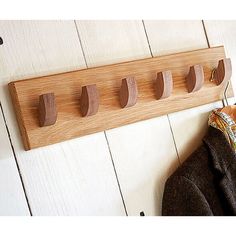 a coat rack with five coats hanging on it