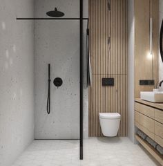 a bathroom with a toilet, sink and shower stall in it's center area