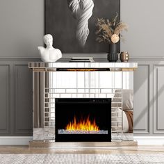 a living room with a fire place in the center and a painting on the wall