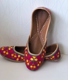 With the elegance of the embroidery work, this jutti is love at first site. Club this sophisticated piece with any outfit to get that perfect chic look.This multi coloured jutti is perfect for any occasion and any outfit.SPECIFICATIONS:•Upper/Panna - Embroidered Fabric base •Back/Adda - Embroidered Fabric base •Lining - Leather•Sole/Talla - Vegetable tanned leather soleNOTE: 1. Please mention the size you wish to order as per the size chart when you checkout. (Buyer should measure the foot from Traditional Wedding Shoes With Embroidery And Round Toe, Flat Embroidered Wedding Shoes For Festivals, Embroidered Flat Wedding Shoes For Festivals, Traditional Embroidered Closed Toe Wedding Shoes, Traditional Flat Embroidered Wedding Shoes, Embroidered Closed Toe Wedding Shoes, Embroidery Wedding, Punjabi Jutti, Leather Footwear