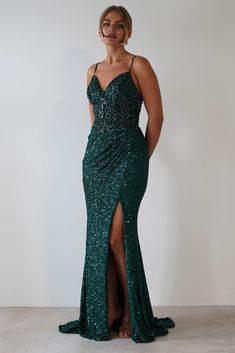 Perfect for debs, prom, a glamorous evening or special event. Shimmer with sophistication in this sequin mermaid gown, featuring a structured bodice, delicate straps, and a dramatic thigh-high slit Highlights Stunning Mermaid gown Embroidered with sequins and beads on a sheer midriff Padded cups Available in Black, Green & Rose Gold Sizing The model is 5'10 and wears UK size 8 / S / US size 4 Fit & Fabric Made from 100% Polyester Rear zipper Lined Length from top of shoulder to hem: 155cm Length Oh Hello Clothing, Celebrity Inspired Dresses, Fitted Gowns, Sequin Gown, Inspirational Celebrities, Green Rose, Mermaid Gown, Formal Dresses Prom, Inspired Dress