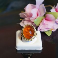 "Mid Century 9kt gold amber ring, Vintage Baltic amber ring, Large amber gold ring, Gift for her, November birthstone NT7 Marked 375 for 9 kt gold, maker mark, anchor for Birmingham, \"A\" for 1950 Baltic amber is oval shape  21x17mm,   Ring gallery 23,8x19,6,mm and 9,9 mm above the finger and band at the back is 2mm split shoulders  Ring Size 6 Total weight 5,86 gram Birthstone: November's birthstone is Amber. Amber is not an actual stone but fossilized sap from ancient trees, aging over millions of years. Amber symbolizes courage, and has been used in the Far East for protecting travellers and ward off bad spirits. The stone is in good condition promptly set , no damages or repairs. display box is not included. The ring will arrive in a contemporary gift box see last picture If you wish Ancient Trees, Bad Spirits, Ancient Tree, Amber Ring, Antique Boxes, Single Stone, November Birthstone, Baltic Amber, Ring Vintage