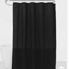 the shower curtain is black and white in color