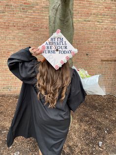 a woman wearing a graduation cap that reads, it's my arrival be your use today