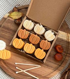 a box filled with cookies and marshmallows on top of a table