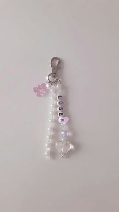 a keychain with beads and charms attached to it