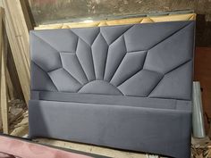 an upholstered headboard is shown in the process of being made into a bed