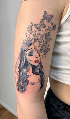 a woman with butterflies on her head is shown in this tattoo art photo by artist markiek