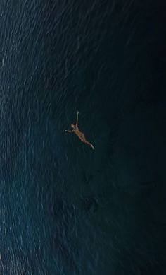 two people are swimming in the ocean together