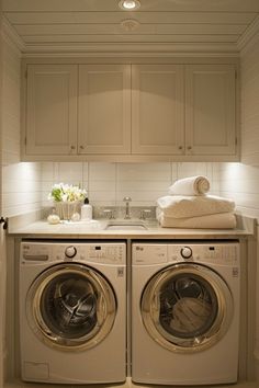 a washer and dryer in a small room