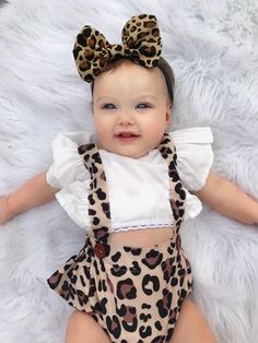 Our darling LEOPARD overall romper is a must-have for all little wild girls. The super cute overall-style bloomers with ruffles on the back and a big bowtie are combined with a white, angel wing top and a matching headband to complete the look. Material: Cotton/Polyester Blend Playful White Jumpsuits And Rompers With Ruffles, Playful White Jumpsuit With Ruffles, Overall Romper, Wild Girl, White Angel, Matching Headband, Quality Fashion, Baby Toddler, Ruffles