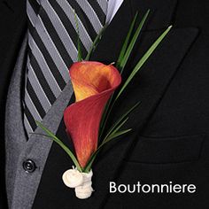 a man wearing a suit and tie with a flower in his lapel pin on his lapel