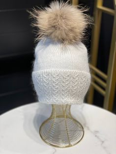 Description These luxurious hats will keep you warm in the colder months. Each hat comes with a detachable large fur pompom made with natural fur. Lined with warm fleece these hats will sure keep you warm during those cold winter days. Made from real angora blend; 30% angora, 70% wool Pompom: genuine racoon fur; Fleece lined; One size fits all; Detachable fur Pompom; Machine washable in a cold water. Take off the pompom before washing. For best results - hand wash and dry flat. Made in Turkey. Wool Pompom, Racoon, Winter Days, Winter Day, Cold Winter, Cold Water, Lilac, Pom Pom, Hand Wash