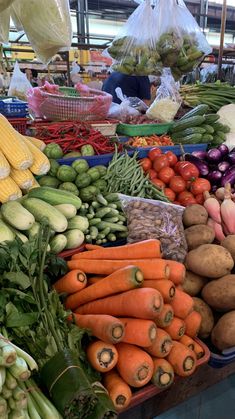 an assortment of vegetables on display at a market