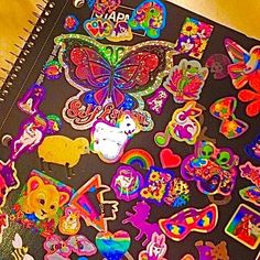 a notebook covered in lots of colorful stickers