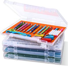 a plastic box filled with lots of different colored pens